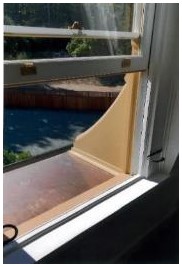 After: detail of added dormer jamb trim with no applied molding as a subtle cue denoting new construction